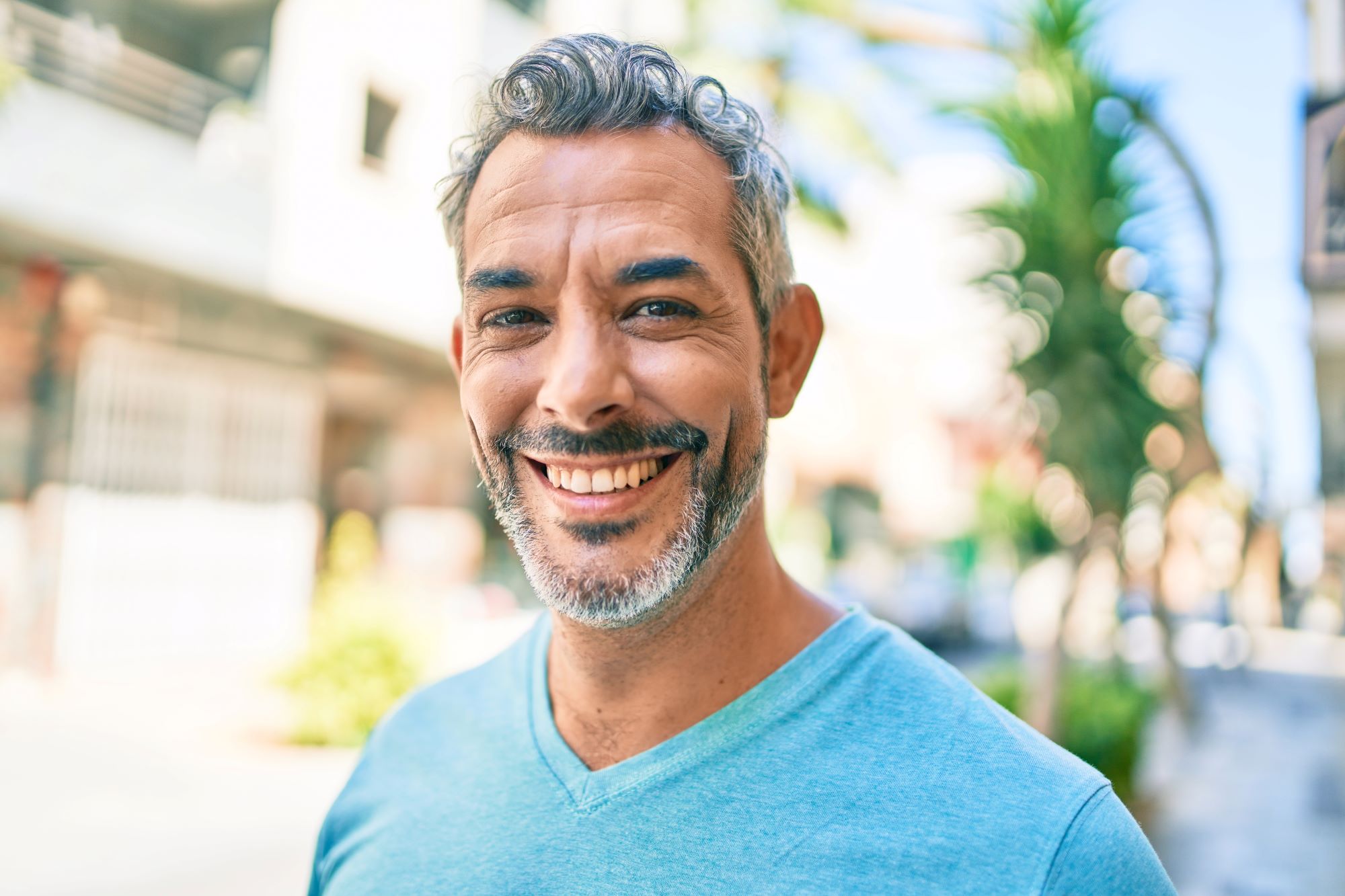 Middle aged man smiling at camera